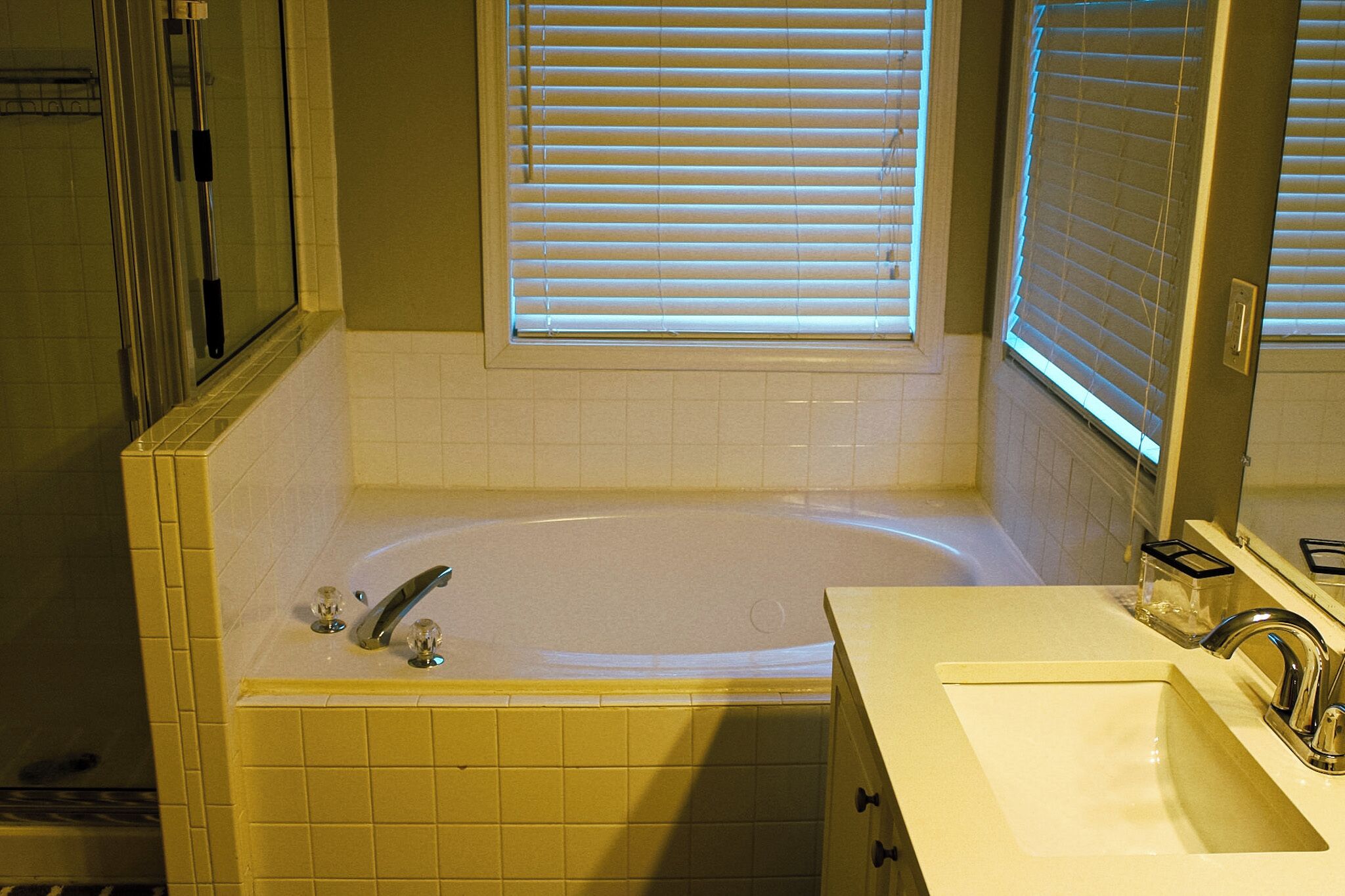 Jetted bath, hair dryer, towels, toilet paper