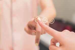 A close-up of a hand interacting with a touchscreen interface. - SGV+Disney+Rose Bowl•King Studio near DTLA (Alhambra)