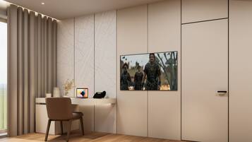 A modern room with a desk, chair, and a large framed picture on the wall.