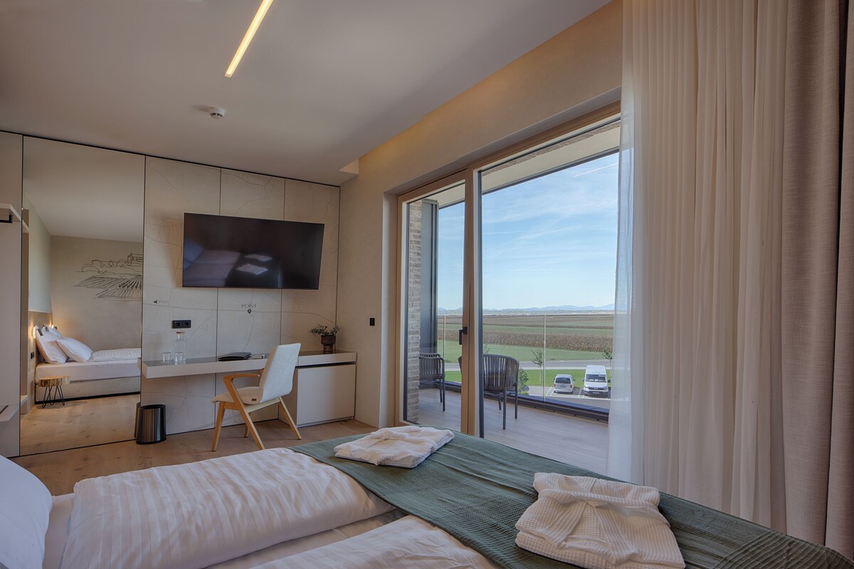 Deluxe Double Room, Balcony | Bathroom | Shower, hair dryer, slippers, towels