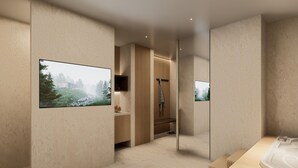 A modern bathroom with a large mirror, a bathtub, a shower, and a toilet.