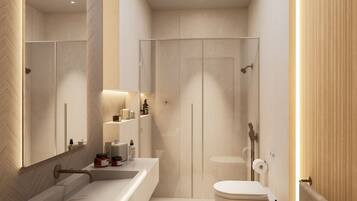 Deluxe Suite | Bathroom | Shower, hair dryer, slippers, towels