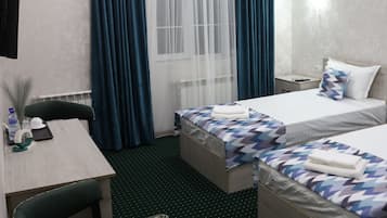 Standard Twin Room, City View | In-room safe, desk, laptop workspace, iron/ironing board