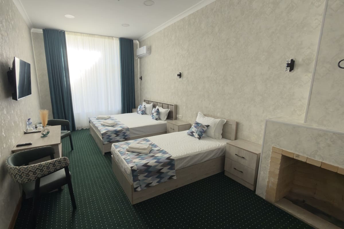 Standard Twin Room, City View | In-room safe, desk, laptop workspace, iron/ironing board (on request)