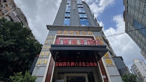 A multi-story building with signage in a foreign language, likely indicating a business or commercial establishment.