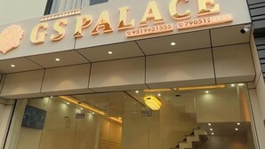 A hotel named 'GSPALACE' with a modern facade, large windows, and a visible staircase leading to the entrance. - GS Palace Ayodhya (Ayodhya)