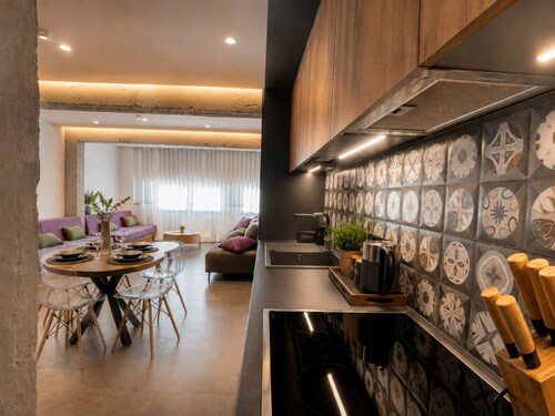 Gold & Concrete Acropolis Residence