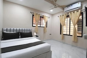 Habitación Deluxe | Sábanas de algodón egipcio, ropa de cama de alta calidad, caja fuerte