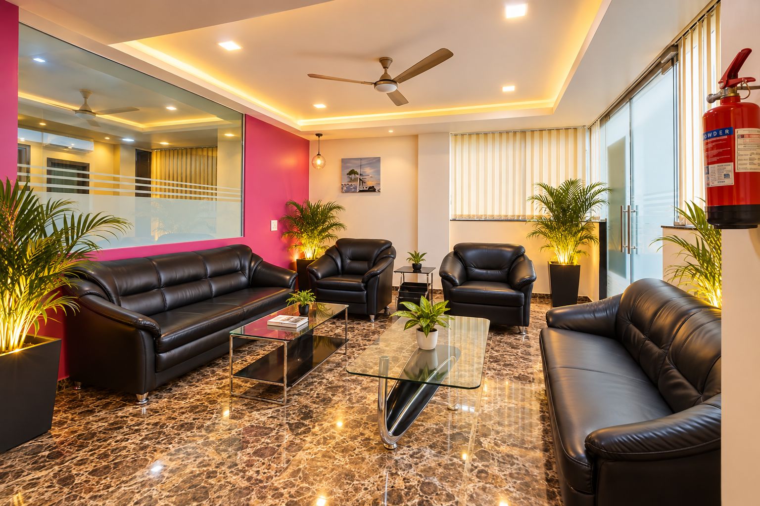 A modern living room with leather sofas, a glass coffee table, and potted plants.