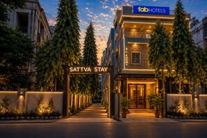 A hotel entrance with a sign for 'SATTVA STAY' and 'fab HOTELS' above. - FabHotel Sattva Stays (Pune)