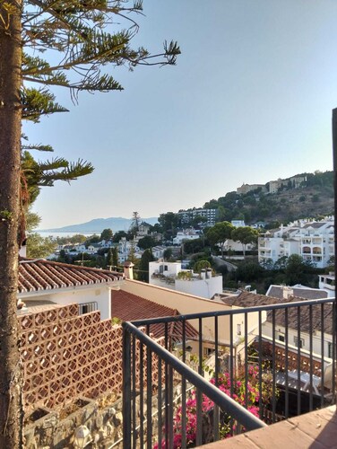 Studio apartment with spacious south- and north-facing terraces, offering views of the sea and the mountains
