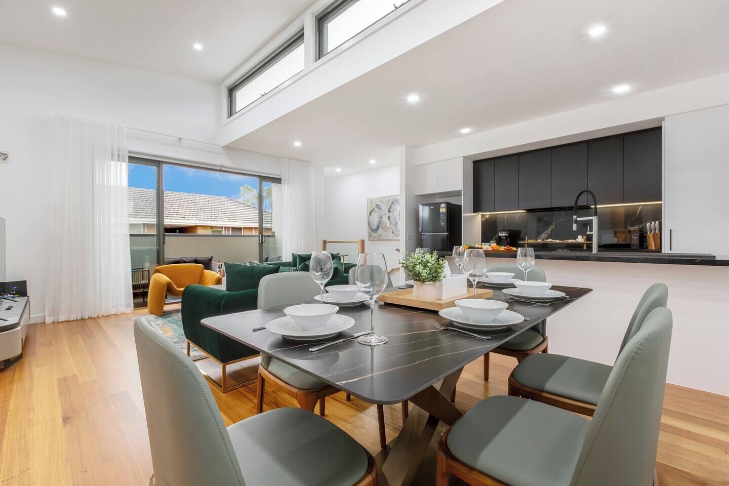 Enjoy meals together in the bright dining space overlooking the open living area.