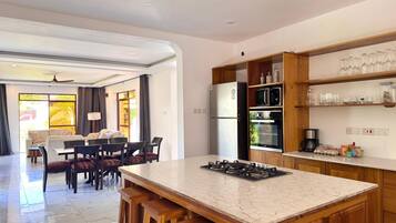 Villa | Private kitchen | Full-size fridge, microwave, oven, cookware/dishes/utensils