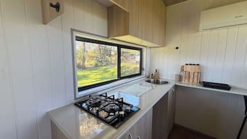 Microwave, stovetop, electric kettle, cookware/dishes/utensils