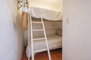 A bunk bed with a ladder, a woven bag, and a patterned pillow. - Paradise Villa #5 | Oceanfront Escape at Playa Encanto (Puerto Peñasco)