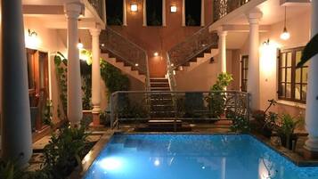 Outdoor pool, open 8:00 AM to 8:30 PM, pool loungers