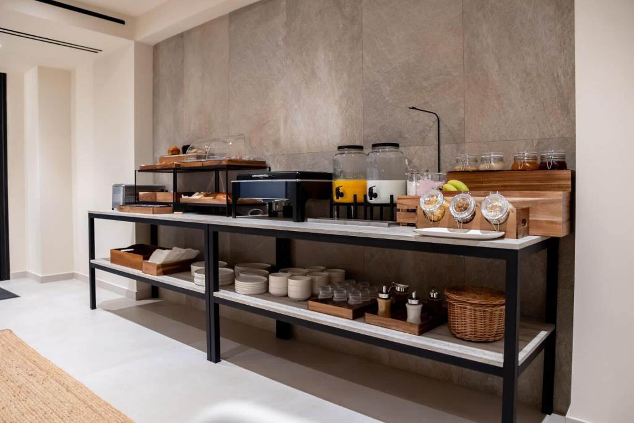 A breakfast bar with various food items and containers.