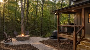 A wooden deck with a fire pit, outdoor seating, and a hot tub. - Thyme Out | Hot Tub | 7 Minutes to Blue Ridge (Blue Ridge)