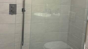 Shower, hair dryer, towels, soap