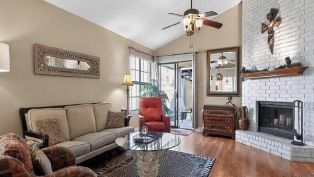 A living room with a sofa, armchairs, a coffee table, and a fireplace. - 5 star Super Host, 3-bedroom, one story,  Hottub Grapevine, Lake Access (Grapevine)