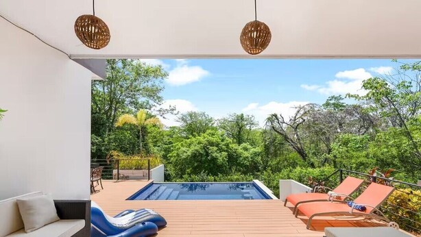 A pool area with lounge chairs, a sofa, and a table. - New Listing • Villa Emsita Hermosa • 3 BR Villa • Private Pool (Playa Hermosa)