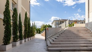 A staircase leading to a building with a clear sky. - Corte Fasanella 3 in Toscolano-maderno (Toscolano Maderno)