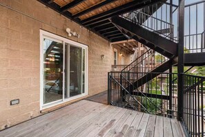 A wooden deck with a metal staircase leading to a balcony. - Pristine Chicago Home - 3BD - 2BA - Free Parking - 2 (Chicago)
