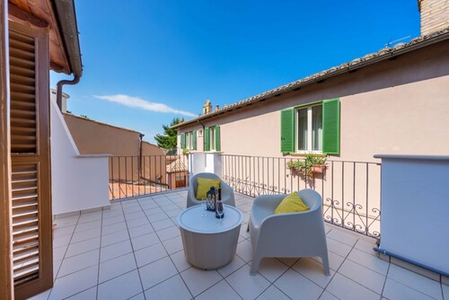 Spacious two-level suite with a kitchen and private terrace in the heart of Atri.Welcome to the Torre Room by Domio, the most exclusive, spacious, and private accommodation in the entire “Residenza del Corso.” If you’re looking for the comforts of 