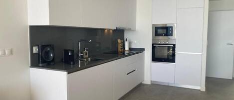 Coffee/tea maker, fridge, microwave, oven