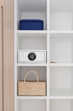 A white shelf with a blue container, a white electronic device, and a woven basket. - Breeze 5-18 | Oceanfront Villa | Infinity Pool (Cruz de Huanacaxtle)