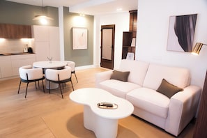 Standard Suite | Living area | 54-inch Smart TV with digital channels, heated floors