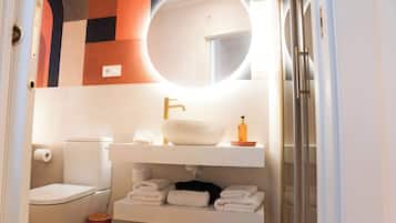 Deluxe Suite, City View | Bathroom | Shower, hair dryer, towels, soap