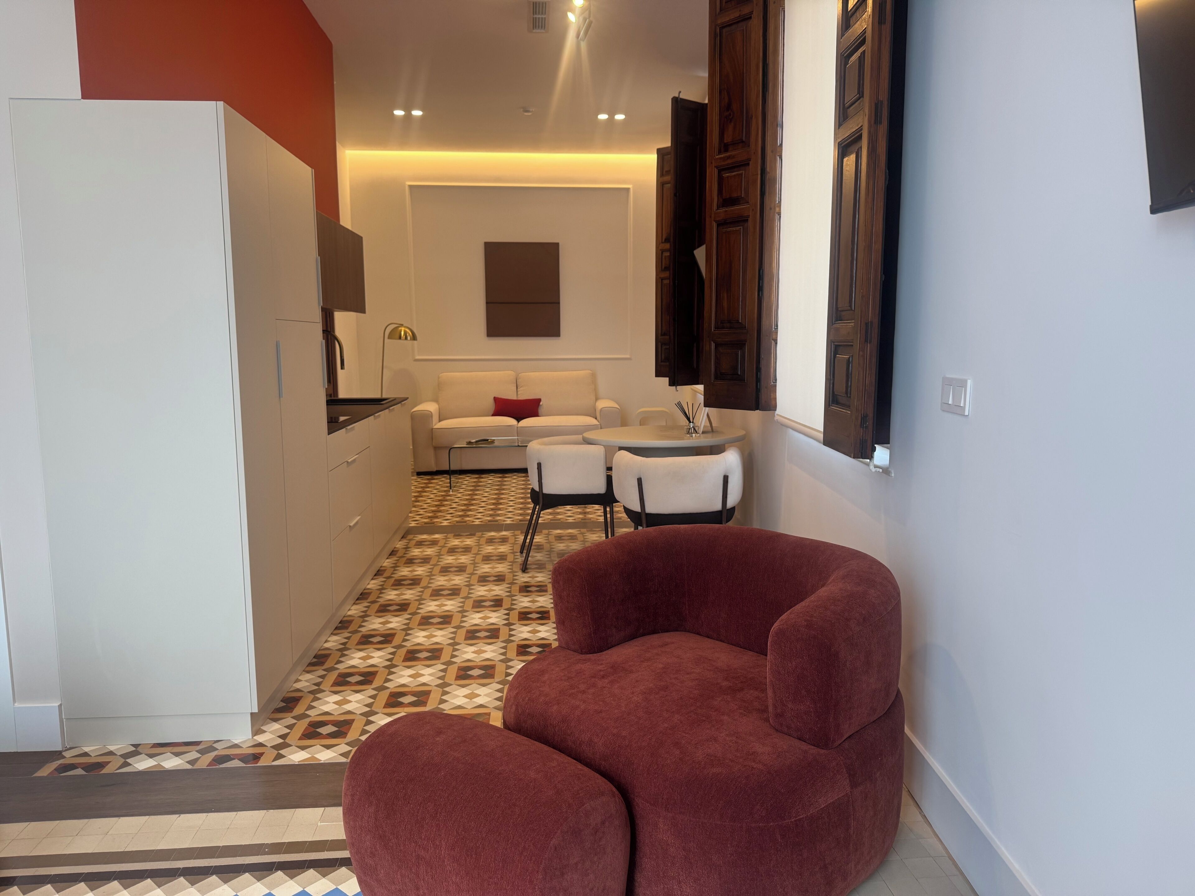 Suite Deluxe, vista a la ciudad | Área de sala de estar