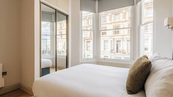 Laptop workspace, cribs (free), WiFi (free), bed sheets