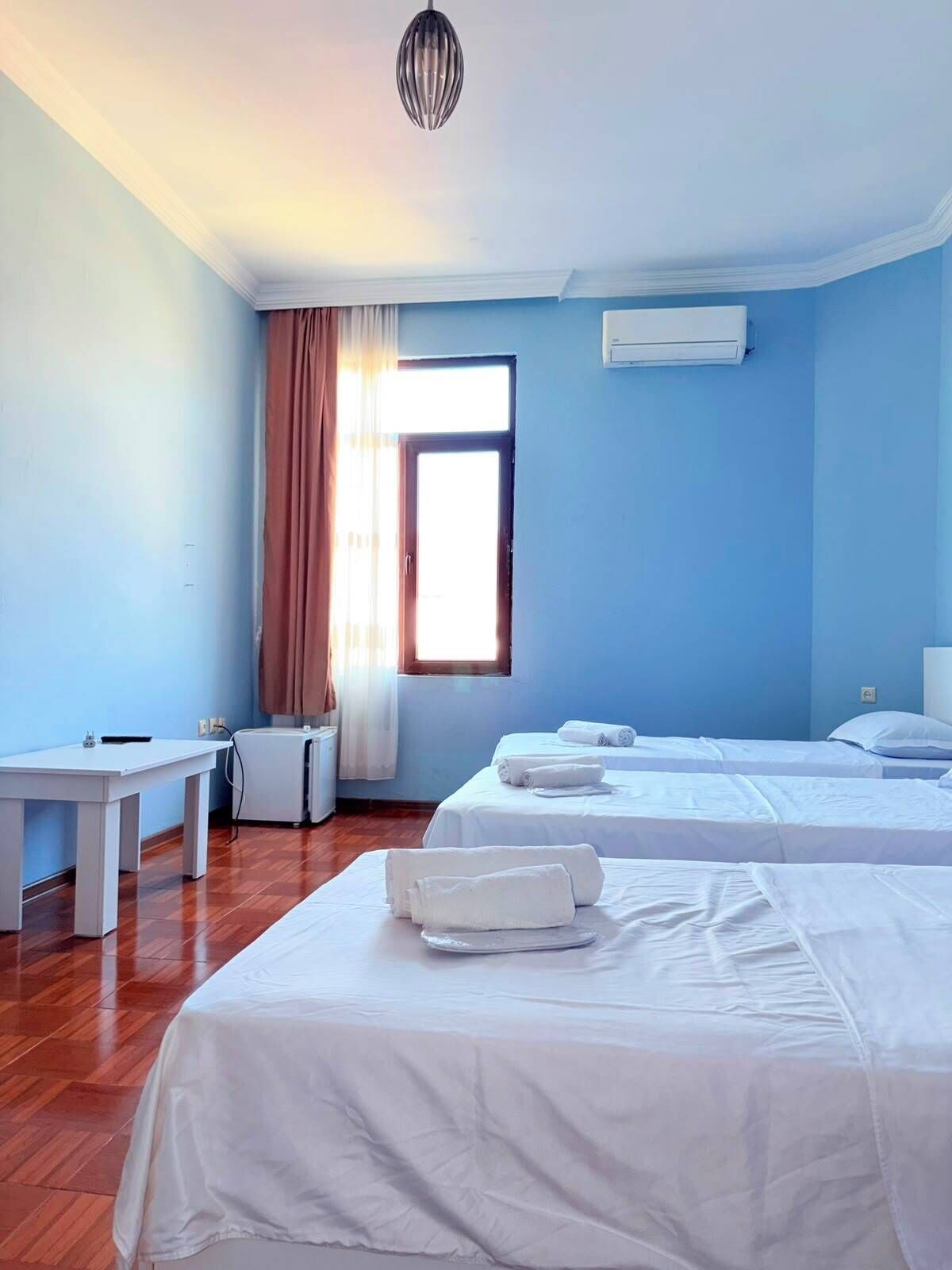 Family Triple Room, Balcony, Park View | In-room safe, desk, laptop workspace, blackout drapes