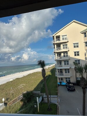A beachfront building with multiple balconies overlooking the ocean. - Remodeled Beachfront-Amazing Location! 
Gated Community. (Destin)