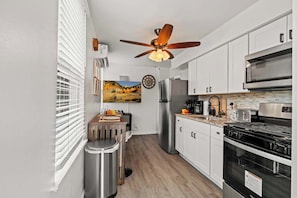 Coffee/tea maker, fridge, microwave, oven