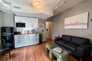 Deluxe Apartment, 2 Bedrooms, Non Smoking, Kitchenette | Living area - Danforth Hotel (Toronto)