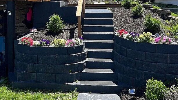 A residential area with a staircase leading to a house, surrounded by flower beds and a wooden deck. - Barefoot Boho Bay - Morse - Cicero Indiana (Cicero)