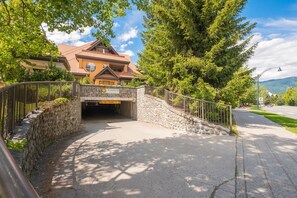 A stone bridge leading to a building with a sign 'Sunpath.' - Beautiful Townhome in Whistler Centre, Pets, BBQ (Whistler)