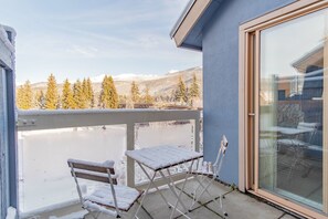 A balcony with a view of snow-covered trees and mountains. - Village location| Pool & hot tub | Free parking (Whistler)