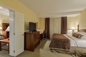 A hotel room with a bed, a desk, a television, and a chair. - Accessible 2BR Suite w/ Daily Breakfast & Pool (McAllen)