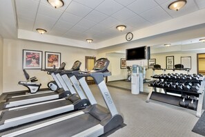 A gym with treadmills, dumbbells, and exercise equipment. - Chic 1BR Suite w/ Free Breakfast, Pool & Hot Tub (McAllen)
