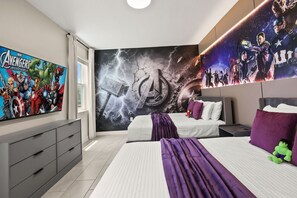 A bedroom with a large wall mural, two beds, a dresser, and a nightstand. - Resort Amenities Included! 7 BD/ 6 BA/ Storey Lake 4585 TB (Kissimmee)