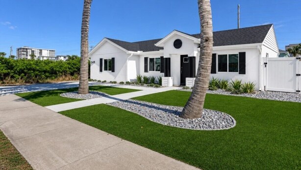 A modern two-story house with a white exterior, black shutters, and a black front door. - 🏖️3BD/2BA Walk to Beach & Downtown / Pool / 349NO (Cocoa Beach)