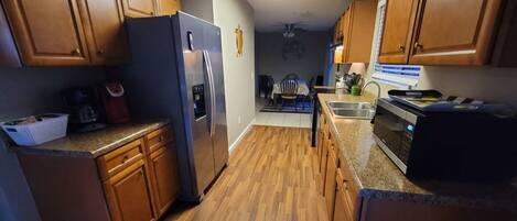 Coffee/tea maker, fridge, microwave, oven