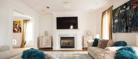 TV, fireplace, books