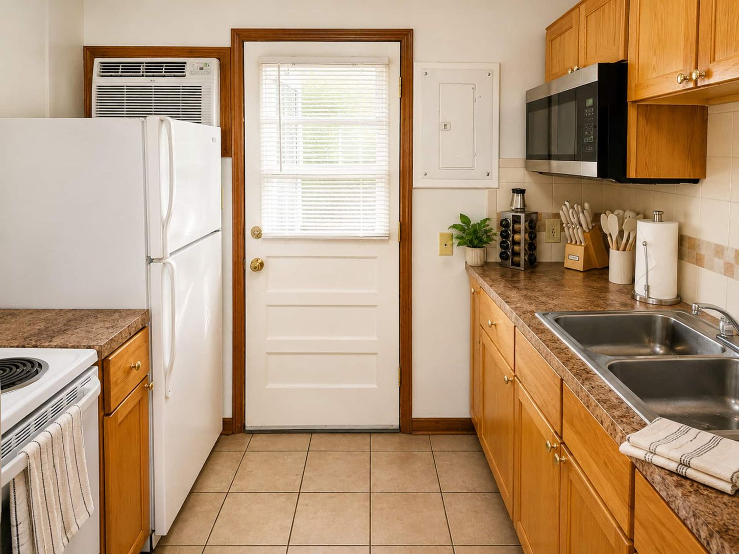 Kitchen with full-size fridge and backyard access