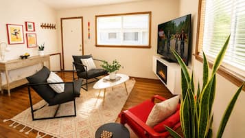 Living room with electric fireplace and smart TV