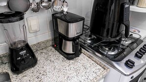 A kitchen with a blender, coffee maker, and stove. - Boutique Apartment | 5 min from Copacabana Beach and Metro | Restaurants, Bars and Shops (Rio de Janeiro)